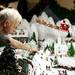 Saline resident Charles Elkins points out a detail in his North Pole display in his basement on Monday. Elkins has been working on these creations for ten years and this is his favorite display. Daniel Brenner I AnnArbor.com